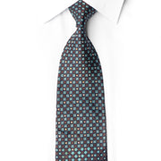 San-Dee LC32 silk necktie laid diagonally, with navy circles, bronze-brown lattice, teal squares and crystal rhinestones.