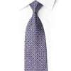 Rolled San-Dee black silk necktie with silver-lilac interlocking leaf motifs and crystal rhinestones at selected intersections.