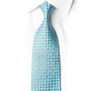 San-Dee aqua silk necktie knotted against a white shirt, featuring a teal geometric lattice, crystal rhinestones and silver sparkles.