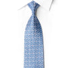 Rolled San-Dee RN656 steel-blue silk necktie with a silver-white triangular star lattice and crystal rhinestone accents.