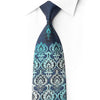 San-Dee RN660 navy silk tie laid diagonally with turquoise and silver damask medallions and clear crystal detailing near the tip.