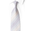 San-Dee RN661 ivory-silver silk tie with blue oval motifs and crystal accents, knotted against a white shirt.