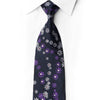 San-Dee RZ96 navy silk tie knotted against a white shirt, with purple and silver daisy-like flowers and crystal rhinestone centers.