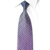 San-Dee pink navy rhinestone silk necktie worn on white shirt, showing gradient checkerboard pattern with crystal sparkles and baroque scroll detail near the knot