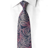 San-Dee navy blue paisley rhinestone silk necktie knotted on white dress shirt collar showing crimson and pink swirls with crystal sparkle detail