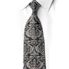 San-Dee black rhinestone silk necktie knotted on white dress shirt collar showing grand-scale silver baroque damask pattern with aurora borealis crystal rhinestone embellishments